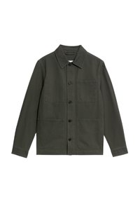 Green canvas jacket with a pointed collar, front button closure, and two patch pockets on the chest. Simple design, long sleeves.
