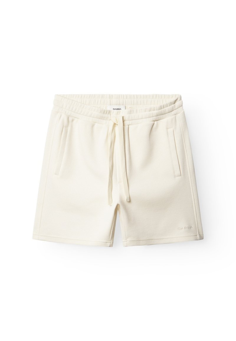 Licht crèmekleurige shorts van gestructureerde stof. Voorzien van een elastische tailleband met trekkoord en twee voorzakken. Logo aan de zijkant.