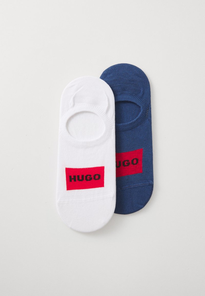cotton blend socks in white and navy blue, featuring a round cut, red rectangular logo with black text "HUGO." Silky texture, seamless edges.