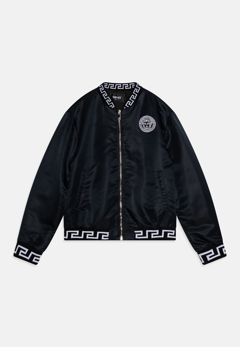 Black satin bomber jacket featuring a zip front, white Greek key pattern on cuffs and hem, and a silver Medusa logo on the chest.