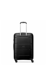 Maleta rígida negra con diseño estriado, mango extensible de aluminio y cuatro ruedas multidireccionales para una movilidad fácil.