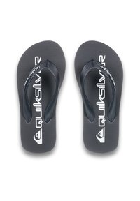 Czarne klapki z fakturowaną podeszwą i czarnymi paskami. Posiadają białe logo Quiksilver oraz subtelny wzór linii na wkładce.