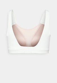 Bijela sportska bralette s niskim leđima, s roze mrežastim panelom i podesivim kopčanjem. Glatka tkanina s prilagođenim oblikom.