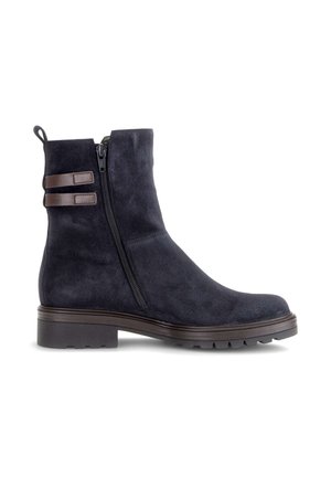 Black suede ankle boot with side zipper, two brown leather straps near the top, and low rugged sole on a white background.