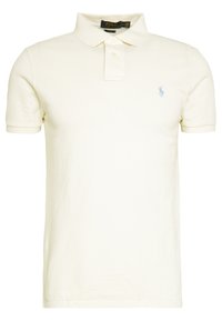 Polo tričko s krátkým rukávem ze smetanové bavlny, s límečkem, tříknoflíkovou légou a malým modrým logem na hrudi.