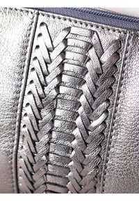 Metallic silver leather pouch featuring intricate woven texture and contrasting stitching, with a smooth zipper detail along the top.