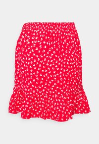 Jupe florale rouge avec une taille élastique froncée, dotée d'un ourlet volé, recouverte de petits motifs floraux blancs sur un fond vif.