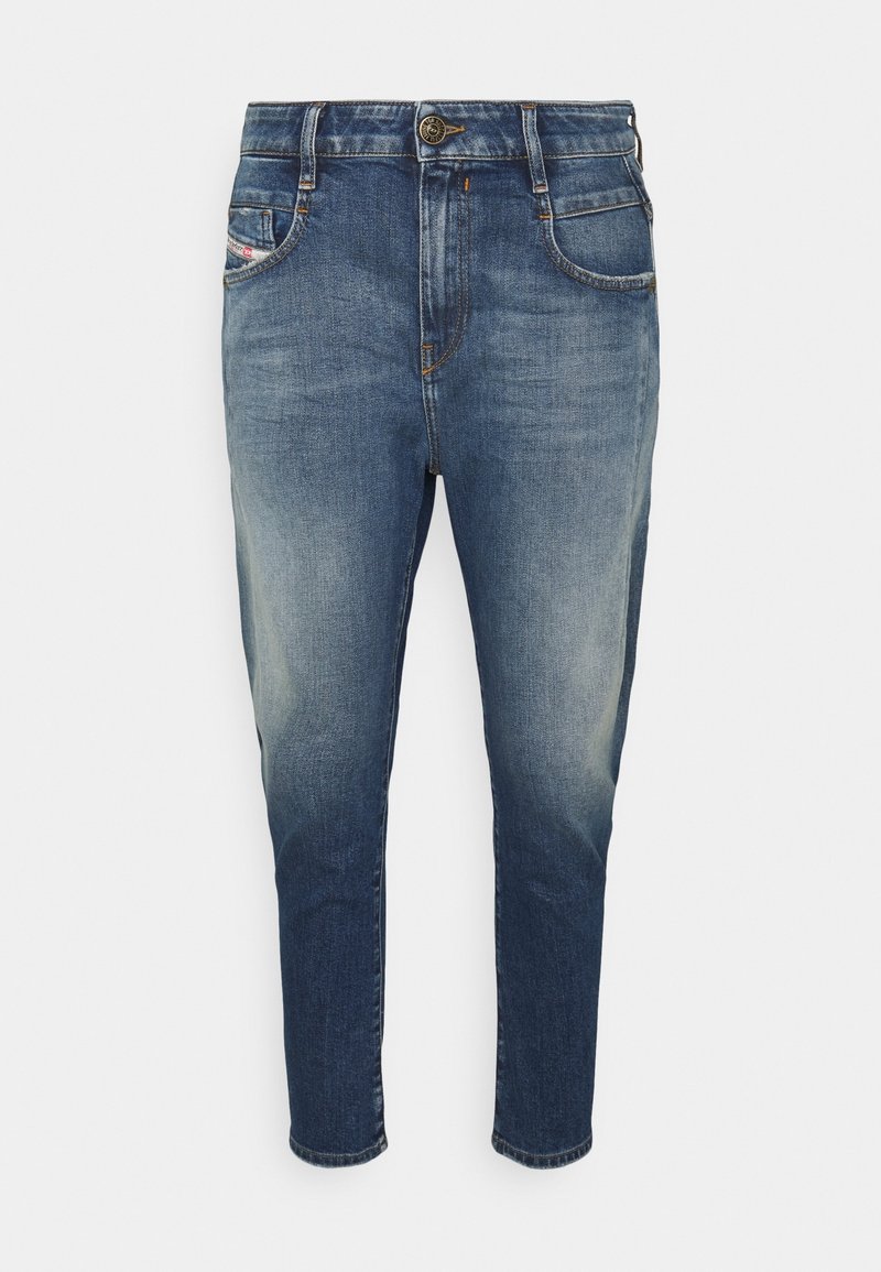 Denimjeans i mörkblått med en blekt effekt. Har en standard midja, fem fickor och en avsmalnande bendesign.