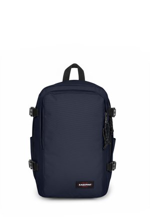Navy blue backpack made of durable fabric, featuring a rectangular design, zippered compartments, side pockets, and a top carry handle.