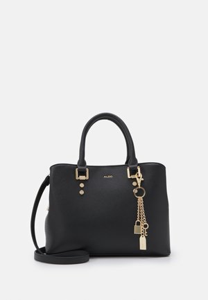 Black handbag with structured design, pebbled texture, gold hardware accents, dual top handles, and a detachable crossbody strap.