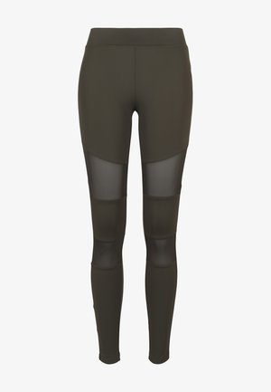 Olivegrønne leggings med meshpanel detaljer, høj talje og tætsiddende design, lavet af strækbart materiale for komfort og bevægelsesfrihed.