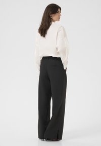 Culture CUALAINE - Kalhoty - black