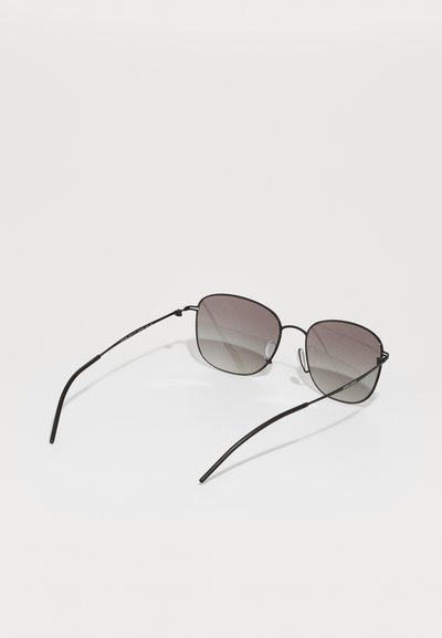 Sunglasses with a thin black metal frame, square lenses transitioning from dark gray to light gray, and sleek black arms with curved tips.
