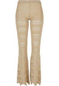 Pantalon tricoté beige avec jambes évasées présentant des rayures horizontales alternées solides et ajourées.