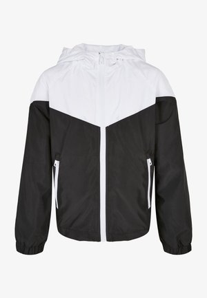 Schwarz-weiße winddichte Jacke mit Kapuze, Frontreißverschluss und seitlichen Reißverschlusstaschen, elastischen Bündchen und Chevron-Farbmuster.