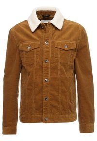 Brun fløjlskjorte med en hvid faux shearling krave, to brystlommer og sorte trykknapper på fronten og manchetterne.