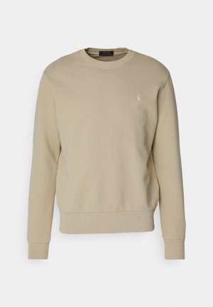 Sudadera beige hecha de una mezcla de algodón, con cuello redondo, puños y dobladillo acanalados, con un pequeño logo bordado en el lado izquierdo del pecho.