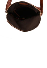 Brown leather handbag with a zip closure. The interior is lined with dark fabric, featuring pockets for organization and a structured shape.