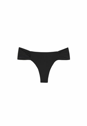 Svart bikiniunderdel med axelbandslösa volanger, en slät textur och en låg midja med minimal täckning.