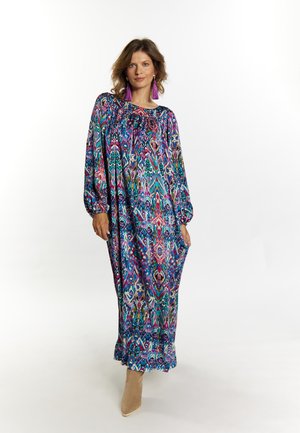 Rochie lungă, cu o croială lejeră, având modele geometrice vibrante multicolore. Fabricată dintr-un material ușor, cu mâneci lungi și gât strâns.