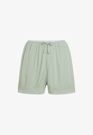 Vaaleanvihreät shortsit, jotka on valmistettu teksturoidusta kankaasta. Niissä on kuminauhavyötärö nyörillä ja pitsireuna helmassa.