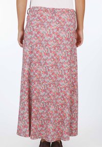 Blumenmaxirock aus weichem, leichtem Stoff. Mit einem mehrfarbigen Muster in Rosa-, Lila- und Grüntönen. Elastischer Bund für zusätzlichen Komfort.