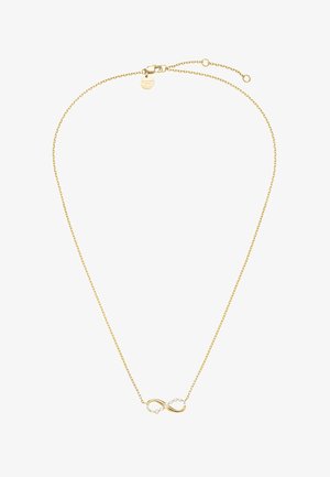 Collier chaîne en or avec un pendentif symbole d'infini partiellement incrusté de petits cristaux clairs et une petite étiquette ronde près du fermoir.