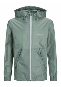 Giacca antivento verde leggera con cappuccio, dotata di cerniera frontale e due tasche frontali. Tessuto liscio con un leggero motivo a quadretti.