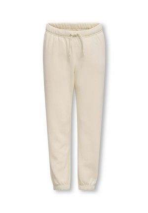 Beige bomuldsjoggingbukser med elastisk talje, snøre, sidelommer og elastiske manchetter ved anklerne.