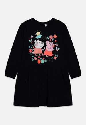 Sort langærmet kjole med en rynket nederdel. Har et farverigt tegneserieprint af to figurer omgivet af blomster og sommerfugle.