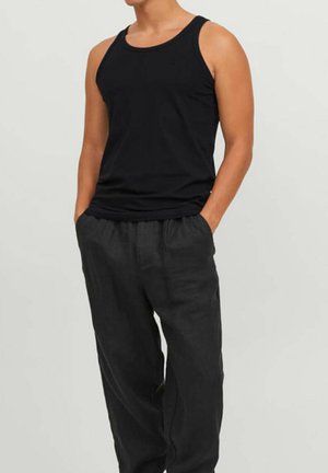 Black sleeveless tank top with a round neckline paired with loose-fitting black linen pants. The fabric appears soft and lightweight.