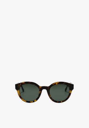 Lunettes de soleil rondes en écaille avec des verres vert foncé et une monture légèrement épaisse.