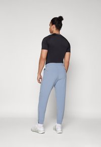 Nike Performance UNLIMITED - Pantalones deportivos - ashen slate/black