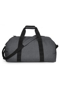Šedý duffel bag s texturovaným povrchem, který má dvě černé rukojeti a nastavitelný ramenní popruh. Zapínání na zip na vrchu.