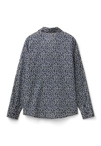 Långärmad skjorta med marinblå bakgrund och ett litet blommönster i vitt och grönt. Knapp-up krage och rak nederkant.