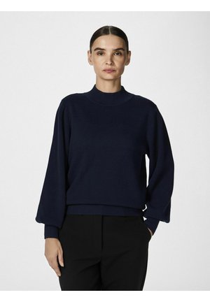 Marineblauwe pullover trui met een hoge hals, losse pasvorm en geribde zoom. Beschikt over lange mouwen en een zachte, gestructureerde stof.