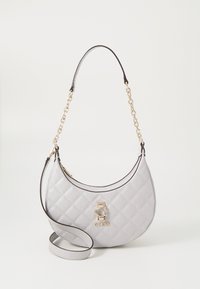 Quilted gray handbag with a curved shape, featuring a gold-tone logo accent and a chain strap. Smooth texture and contrasting black trim.