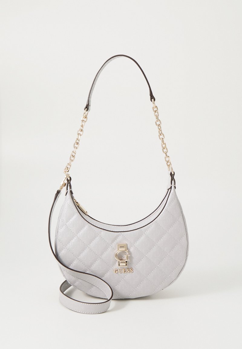 Quilted gray handbag with a curved shape, featuring a gold-tone logo accent and a chain strap. Smooth texture and contrasting black trim.