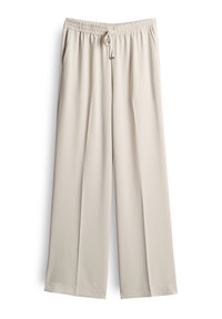 Pantalons larges beige en tissu léger et lisse. Dotés d'une taille élastique avec cordon de serrage et de poches latérales.