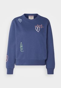 Sweatshirt bleu marine en coton avec une coupe décontractée. Il présente des accents brodés colorés, notamment un cœur et un texte stylisé.