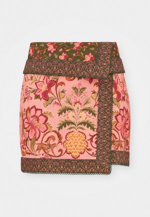 Pink embroidered skirt with floral and fruit patterns, featuring a green border and intricate lace trim at the hem.