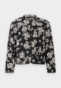 Czarna pikowana kurtka z białym kwiatowym wzorem, z okrągłym kołnierzem, zatrzaskami i dwoma przednimi kieszeniami.