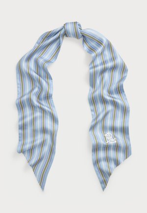 Gaiši zils zīda šalle ar vertikālām svītrām zaļā, violetā un baltā krāsā. Apstrādātas maliņas, un vienā stūrī ir neliels izsiets logo.