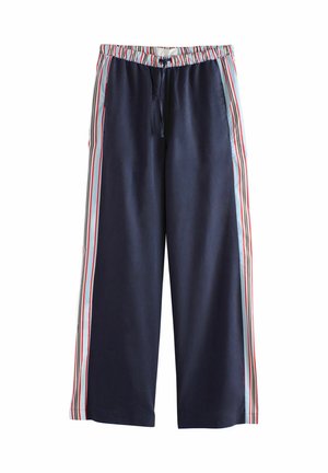 Pantalon large bleu marine avec des rayures verticales multicolores sur les côtés et autour de la taille élastique avec un cordon de serrage devant.