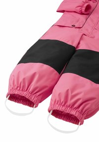 Pink and black outerwear with elastic cuffs, a smooth texture, and a relaxed fit. Notable details include white loops at the cuffs.