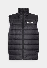 Black puffer vest with high collar, horizontal quilted pattern, front zipper, and white "TERREX" logo on the left chest. Lightweight material.