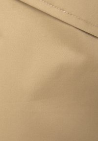 Beige woven fabric with a smooth texture and fine ribbing. The material is lightweight and features a clean, uniform appearance.