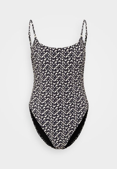 Uimapuku ohuilla olkaimilla, jossa on geometrinen musta ja kerma kuvio. Valmistettu sileästä ja venyvästä kankaasta, jossa on korkea lahje.