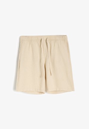 Beżowe lniane szorty z elastycznym pasem i sznurkiem, posiadające boczne kieszenie oraz luźny krój. Gładka tekstura, długość do kolan.