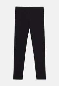 Μαύρο βαμβακερό κολάν με απαλή υφή, εφαρμοστή γραμμή και διακριτική ελαστική μέση, χωρίς ορατά σχέδια ή διακοσμητικά.